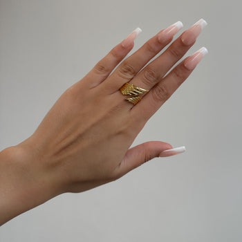 model wearing Irina Wing Wrap Ring crafted in 18k gold plated stainless steel from prya