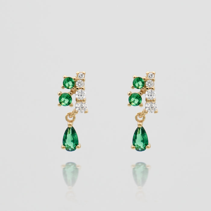 Gold earrings with green and white gemstones.