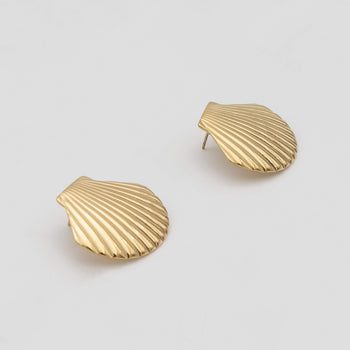 Kailani Seashell Earrings features a unique textured gold design with intricate shell detailing from prya