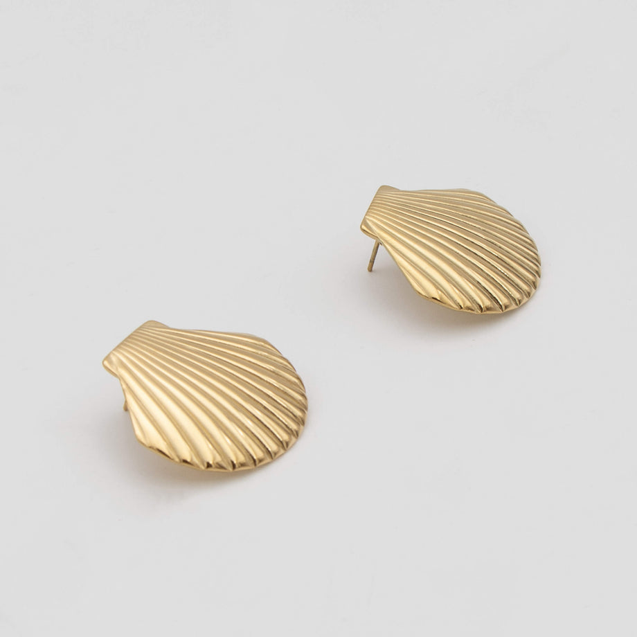 Kailani Seashell Earrings features a unique textured gold design with intricate shell detailing from prya