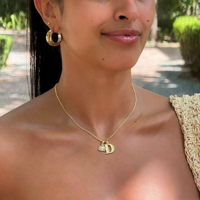 model wearing kayla initial and birthstone necklace in gold from prya