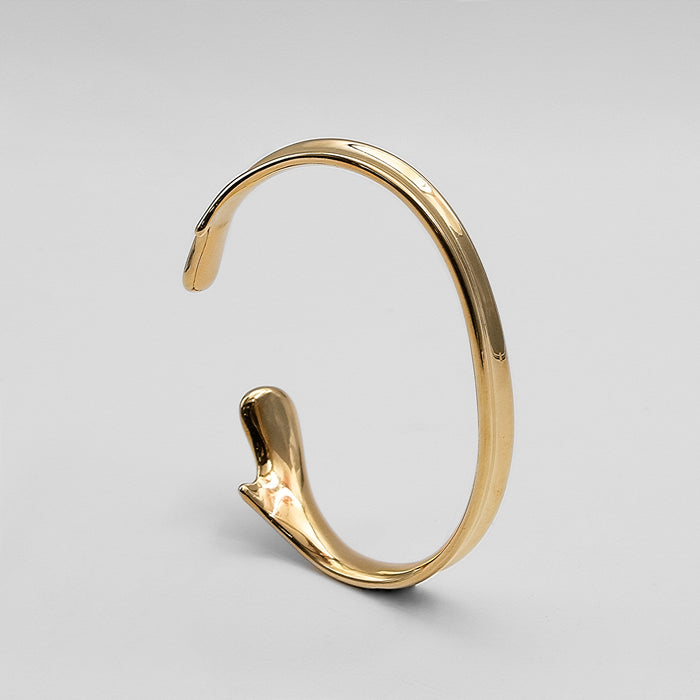 image of gold textured asymmetrical bangle from prya 