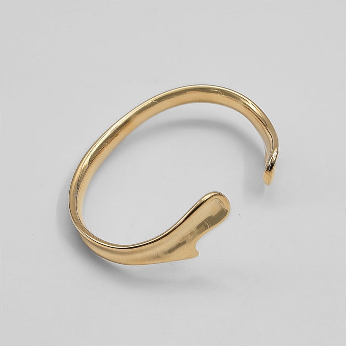 image of gold textured asymmetrical bangle from prya 