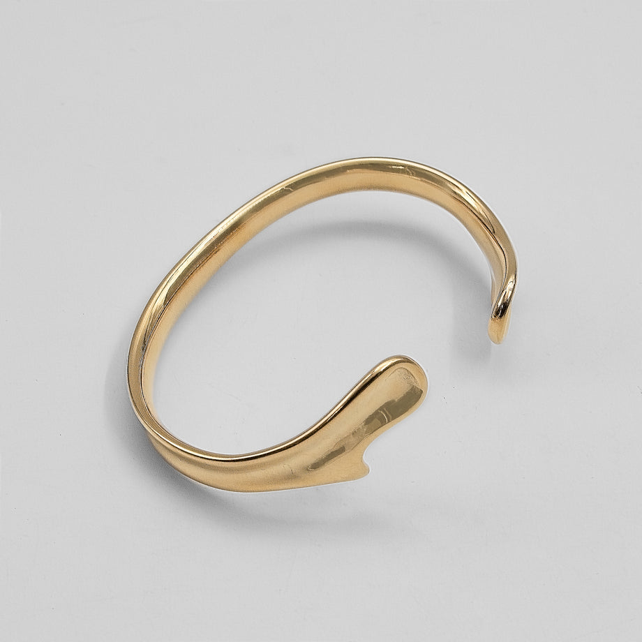 image of gold textured asymmetrical bangle from prya 