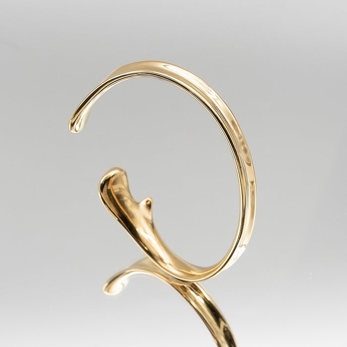 image of gold textured asymmetrical bangle from prya 