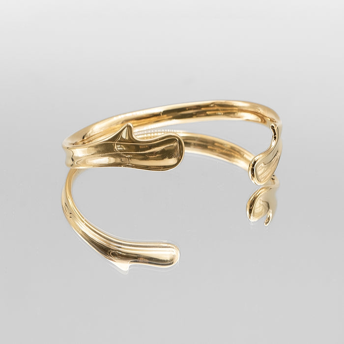 image of gold textured asymmetrical bangle from prya 