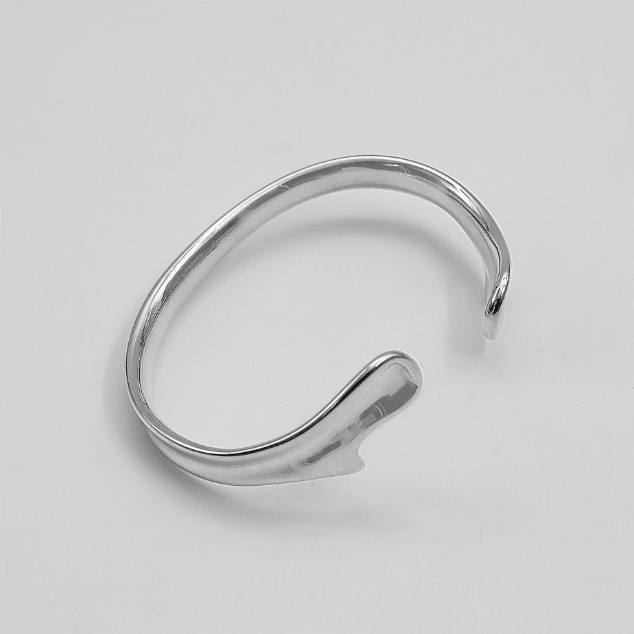 image of silver textured asymmetrical bangle from prya 