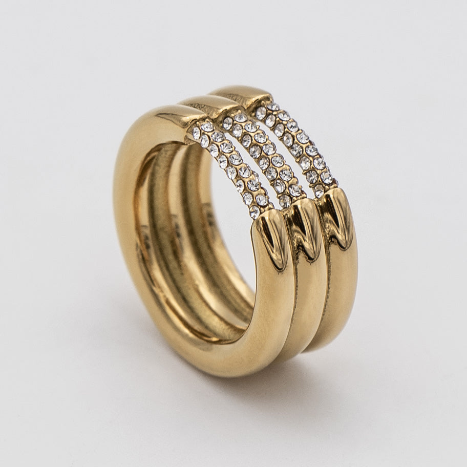 Liana Ring featuring a chunky gold triple band paved with sparkling CZ stones from Prya