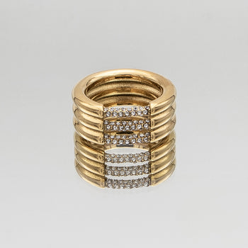 Liana Ring featuring a chunky gold triple band paved with sparkling CZ stones from Prya