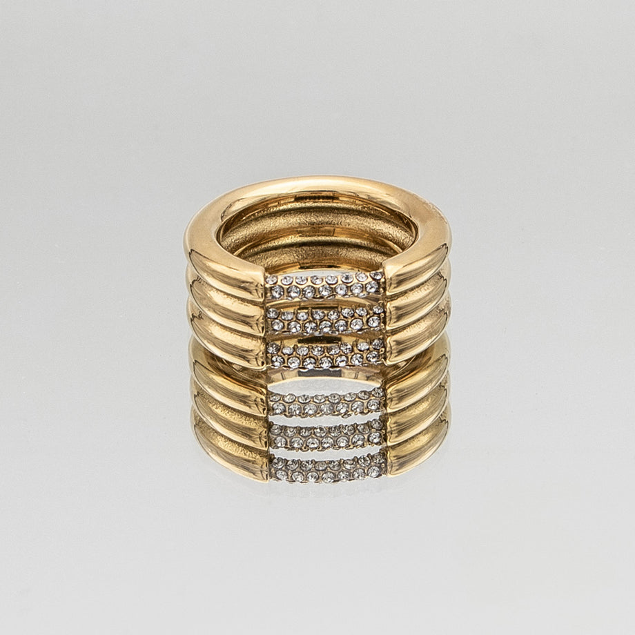 Liana Ring featuring a chunky gold triple band paved with sparkling CZ stones from Prya