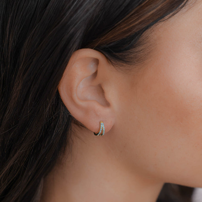 model wearing lola hugge earrings paved with clear cz stones from prya