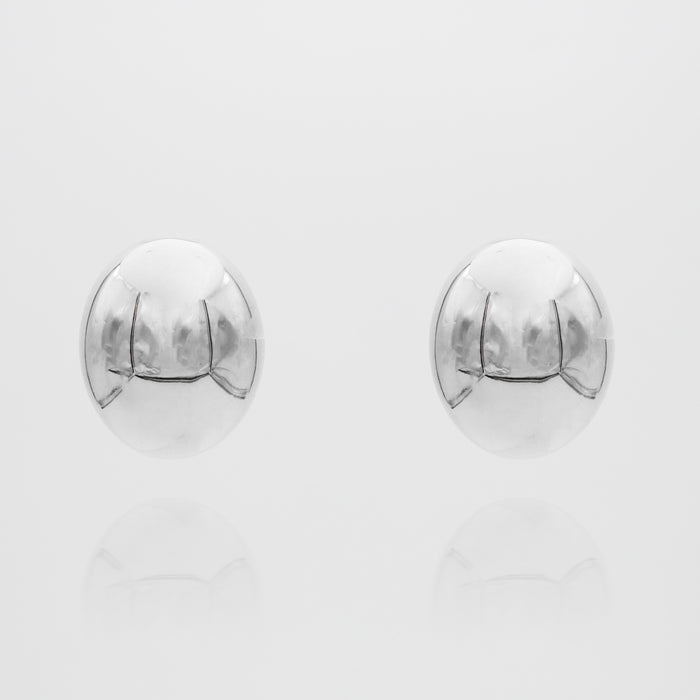 Silver spherical Maeve earrings on white background.