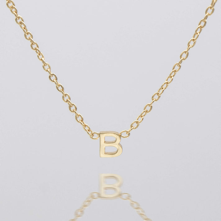 Maia Mini initial necklace in gold by prya