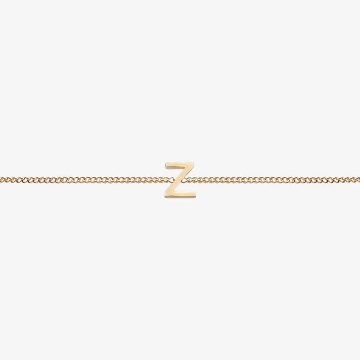  Maia Initial Bracelet with initial pendant on a delicate 18k gold plated chain, perfect accessory for any occasion.