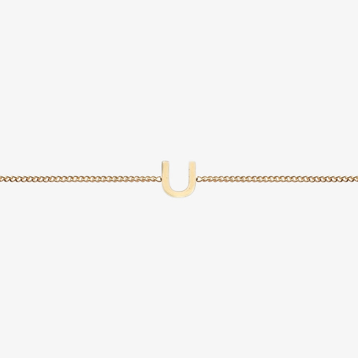  Maia Initial Bracelet with initial pendant on a delicate 18k gold plated chain, perfect accessory for any occasion.