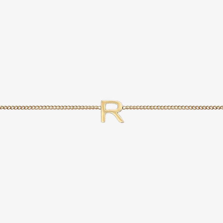  Maia Initial Bracelet with initial pendant on a delicate 18k gold plated chain, perfect accessory for any occasion.