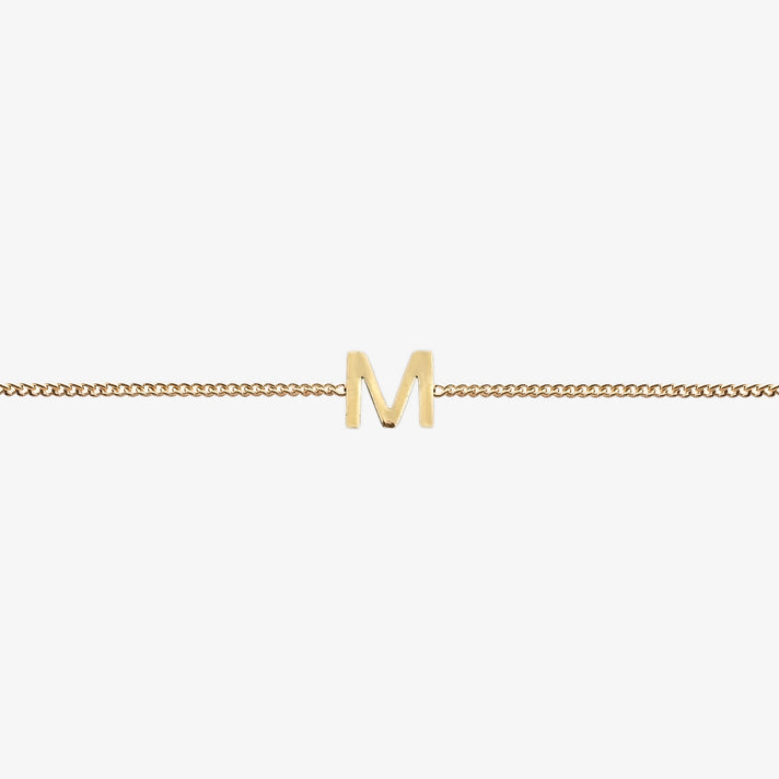  Maia Initial Bracelet with initial pendant on a delicate 18k gold plated chain, perfect accessory for any occasion.
