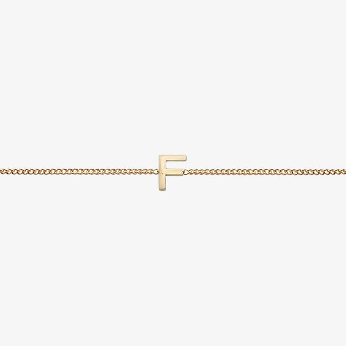  Maia Initial Bracelet with initial pendant on a delicate 18k gold plated chain, perfect accessory for any occasion.