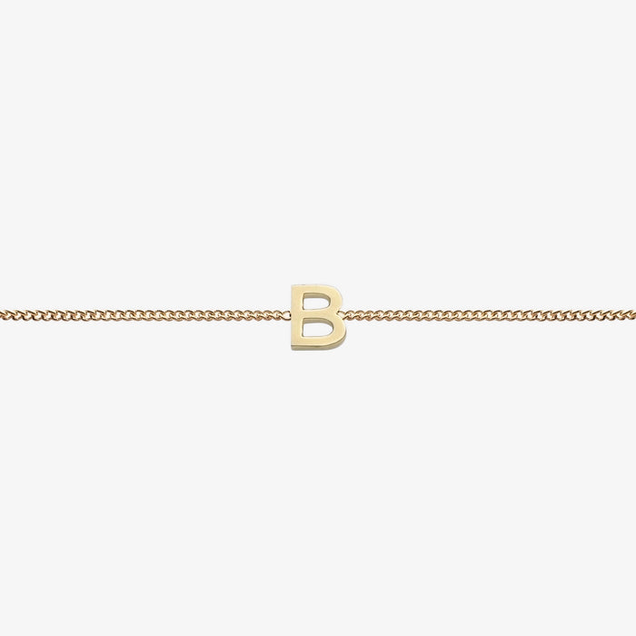  Maia Initial Bracelet with initial pendant on a delicate 18k gold plated chain, perfect accessory for any occasion.