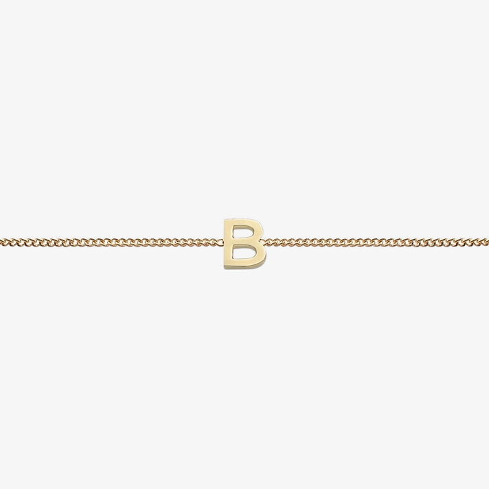  Maia Initial Bracelet with initial pendant on a delicate 18k gold plated chain, perfect accessory for any occasion.
