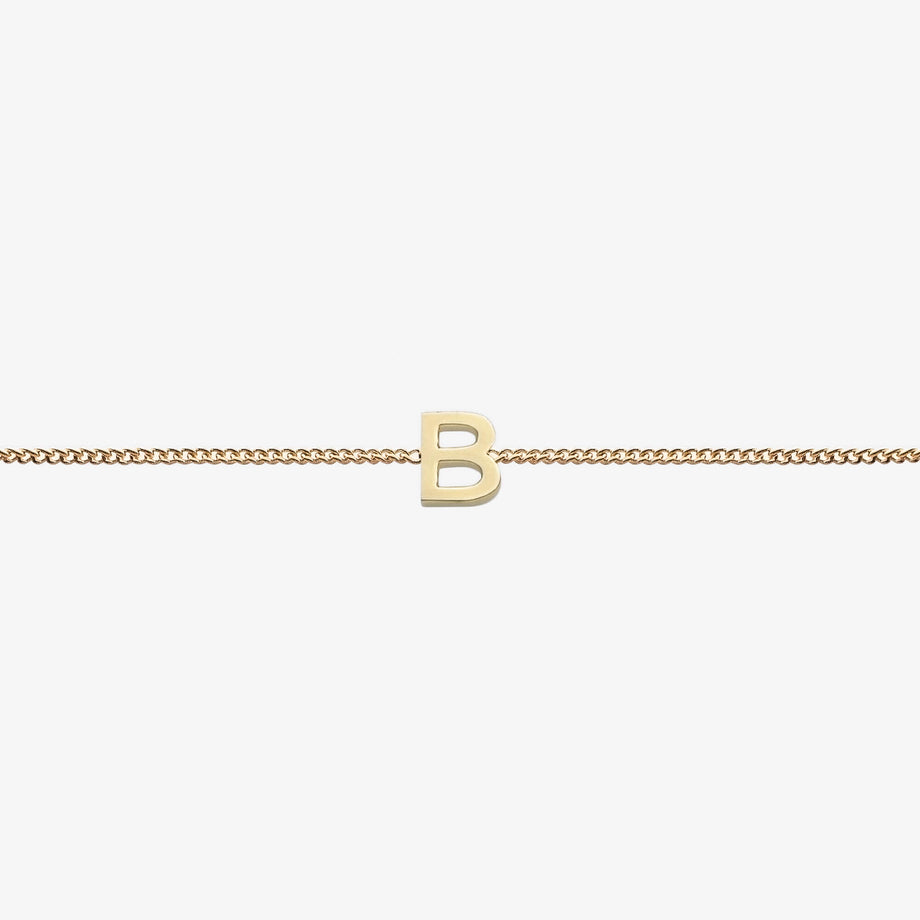  Maia Initial Bracelet with initial pendant on a delicate 18k gold plated chain, perfect accessory for any occasion.