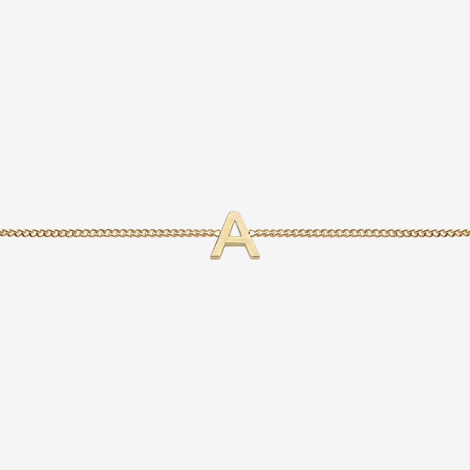  Maia Initial Bracelet with initial pendant on a delicate 18k gold plated chain, perfect accessory for any occasion.
