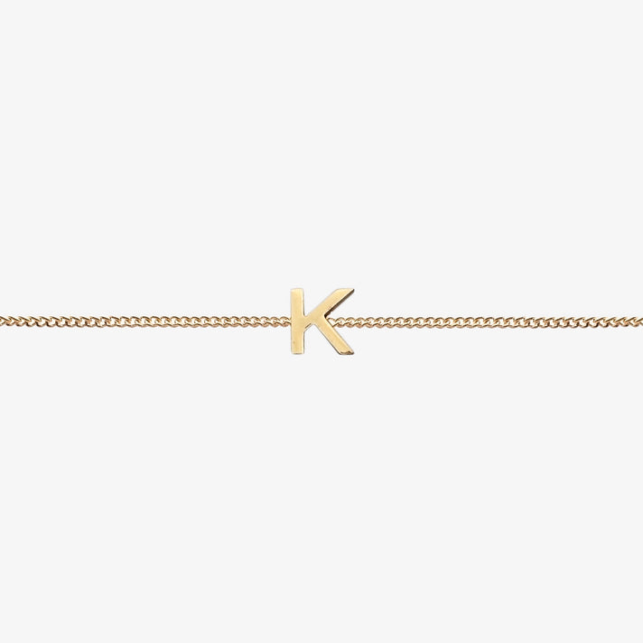  Maia Initial Bracelet with initial pendant on a delicate 18k gold plated chain, perfect accessory for any occasion.
