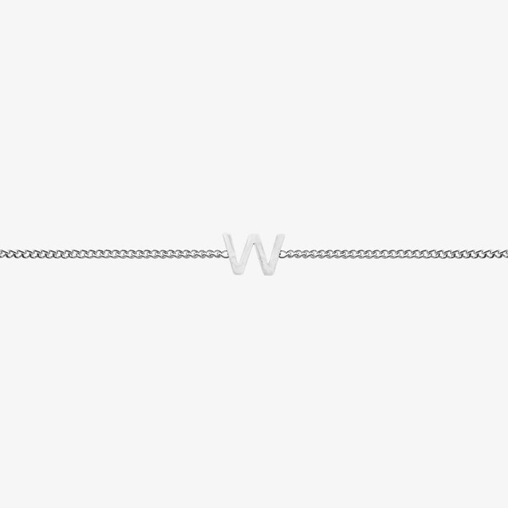 Maia Initial Bracelet with 'W' pendant on a delicate silver chain, perfect accessory for any occasion.