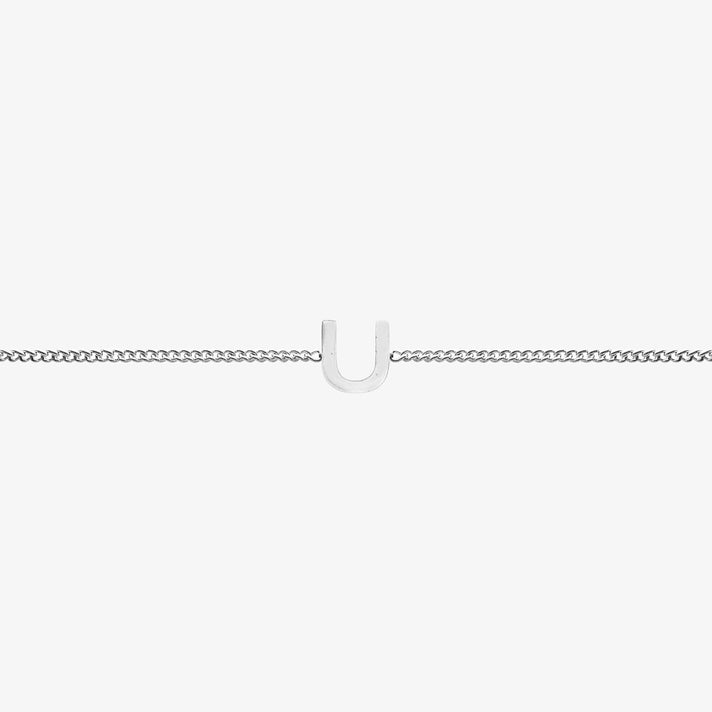 Maia Initial Bracelet with 'U' pendant on a delicate silver chain, perfect accessory for any occasion.