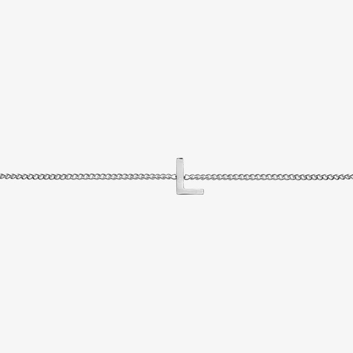 Maia Initial Bracelet with 'L' pendant on a delicate silver chain, perfect accessory for any occasion.
