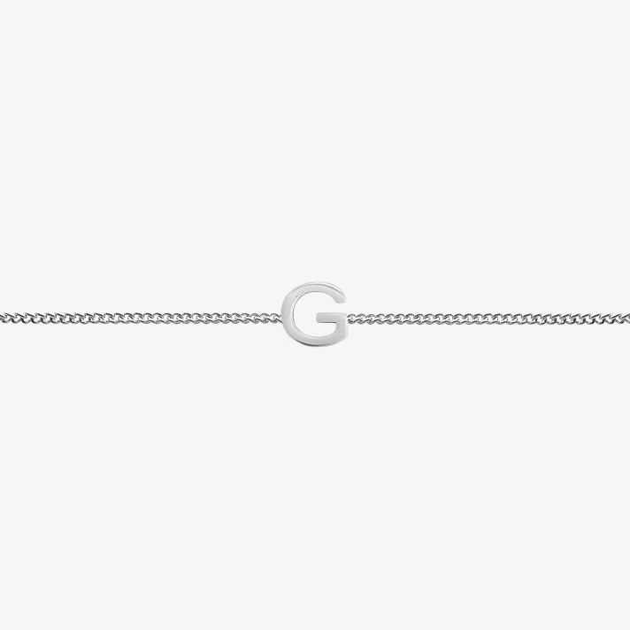 Maia Initial Bracelet featuring a delicate link chain with a prominent 'G' initial pendant.