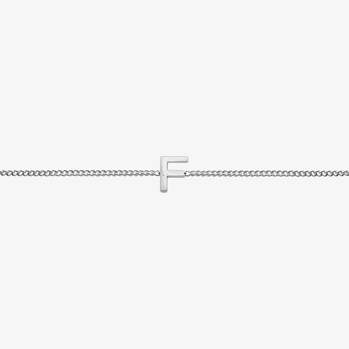 Maia Initial Bracelet featuring a delicate silver chain with an elegant 'F' initial pendant.
