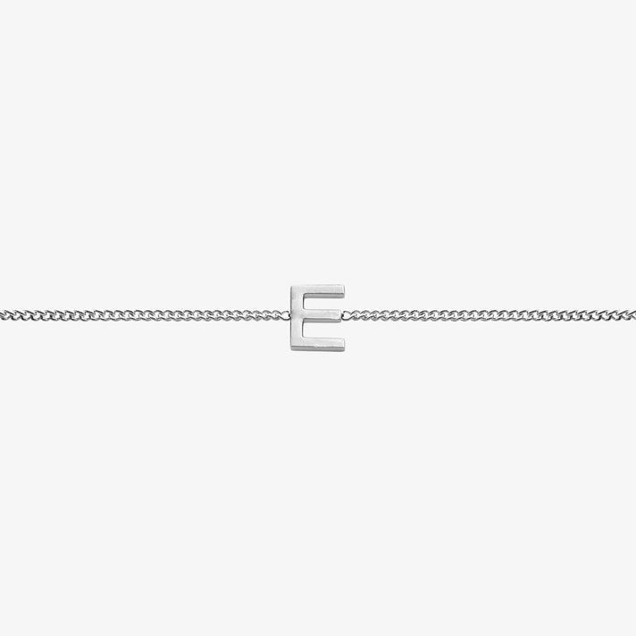 Elegant Maia Initial Bracelet featuring a silver E pendant on a delicate chain, perfect for any occasion.