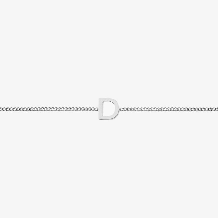 Maia Initial Bracelet with 'D' pendant on a delicate chain, perfect for adding elegance to any outfit.
