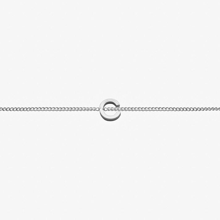 Maia Initial Bracelet featuring a delicate link chain with an elegant initial pendant on a micro curb chain.
