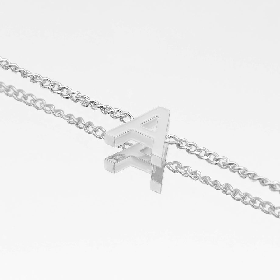 Maia mini initial bracelet in silver featuring a delicate link chain and an elegant 'A' pendant.