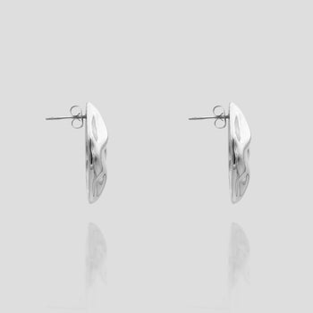 side view of the Versatile and retro style Marina Earrings in silver featuring a stud with a drop earring element from prya