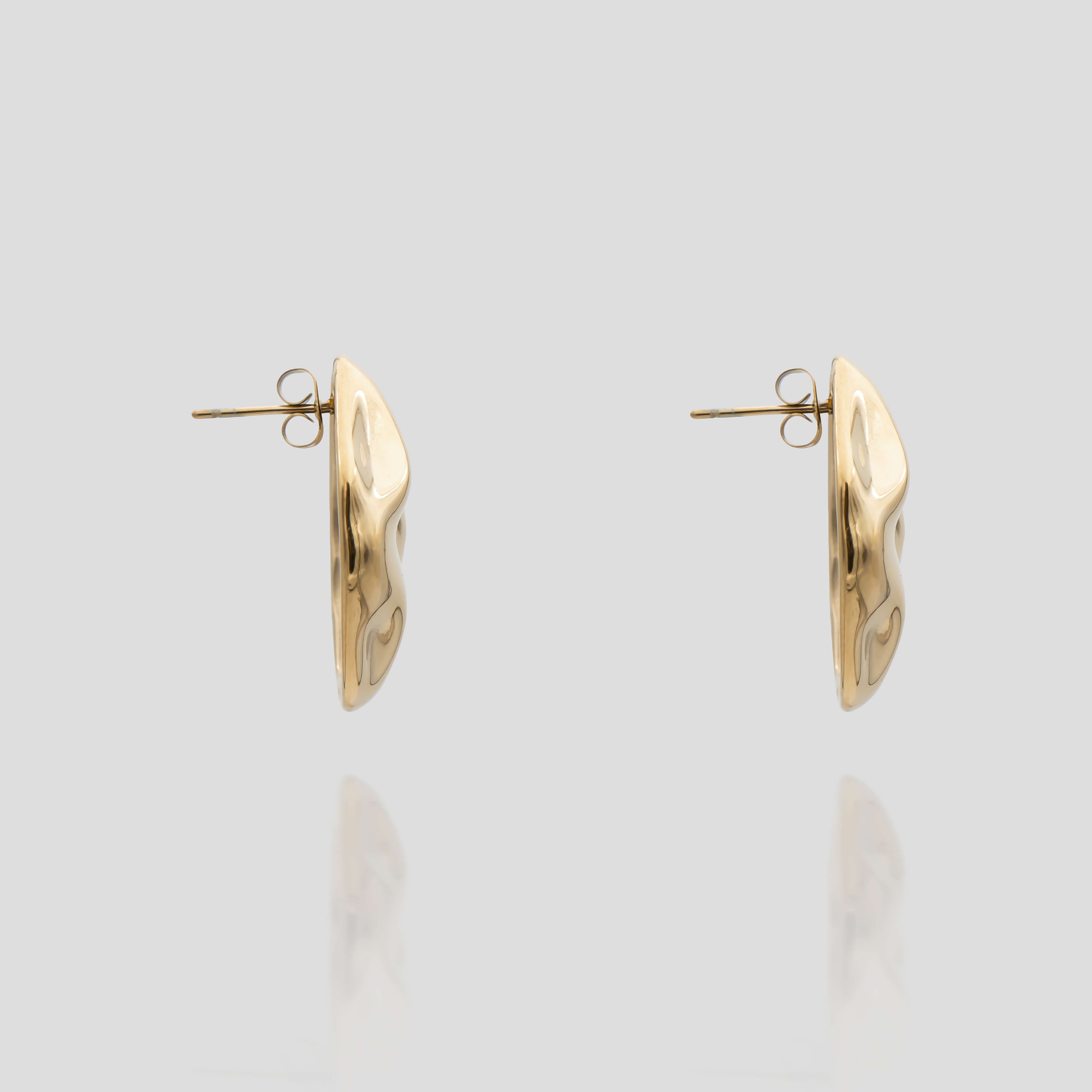 side view of the Versatile and retro style Marina Earrings in gold featuring a stud with a drop earring element from prya