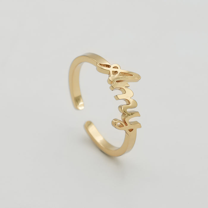 Gold ring with "Amy" in cursive script.