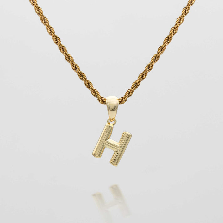 mini bubble initial necklace available in 18k gold or silver plated stainless steel from prya