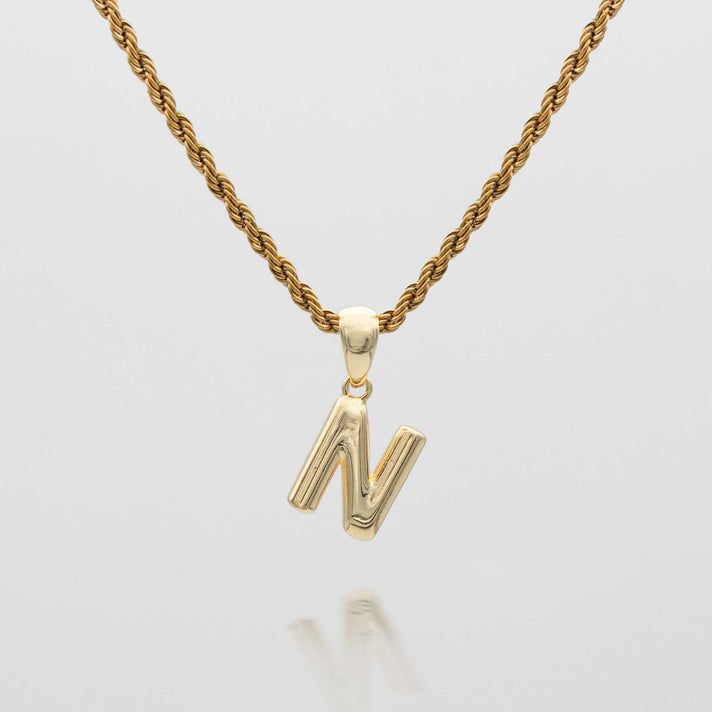 mini bubble initial necklace available in 18k gold or silver plated stainless steel from prya