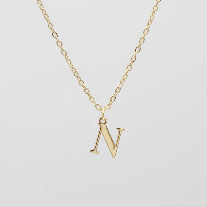 Gold plated initial necklace featuring the letter "N" on a delicate chain, perfect for personalization.