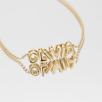 Personalised bubble letter necklace, with gold, silver and rose gold option, featuring customisable ballon-shaped letters, charms, and the & symbol on multiple chain options