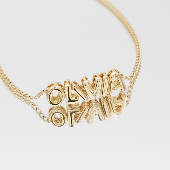 Personalised bubble letter necklace, with gold, silver and rose gold option, featuring customisable ballon-shaped letters, charms, and the & symbol on multiple chain options