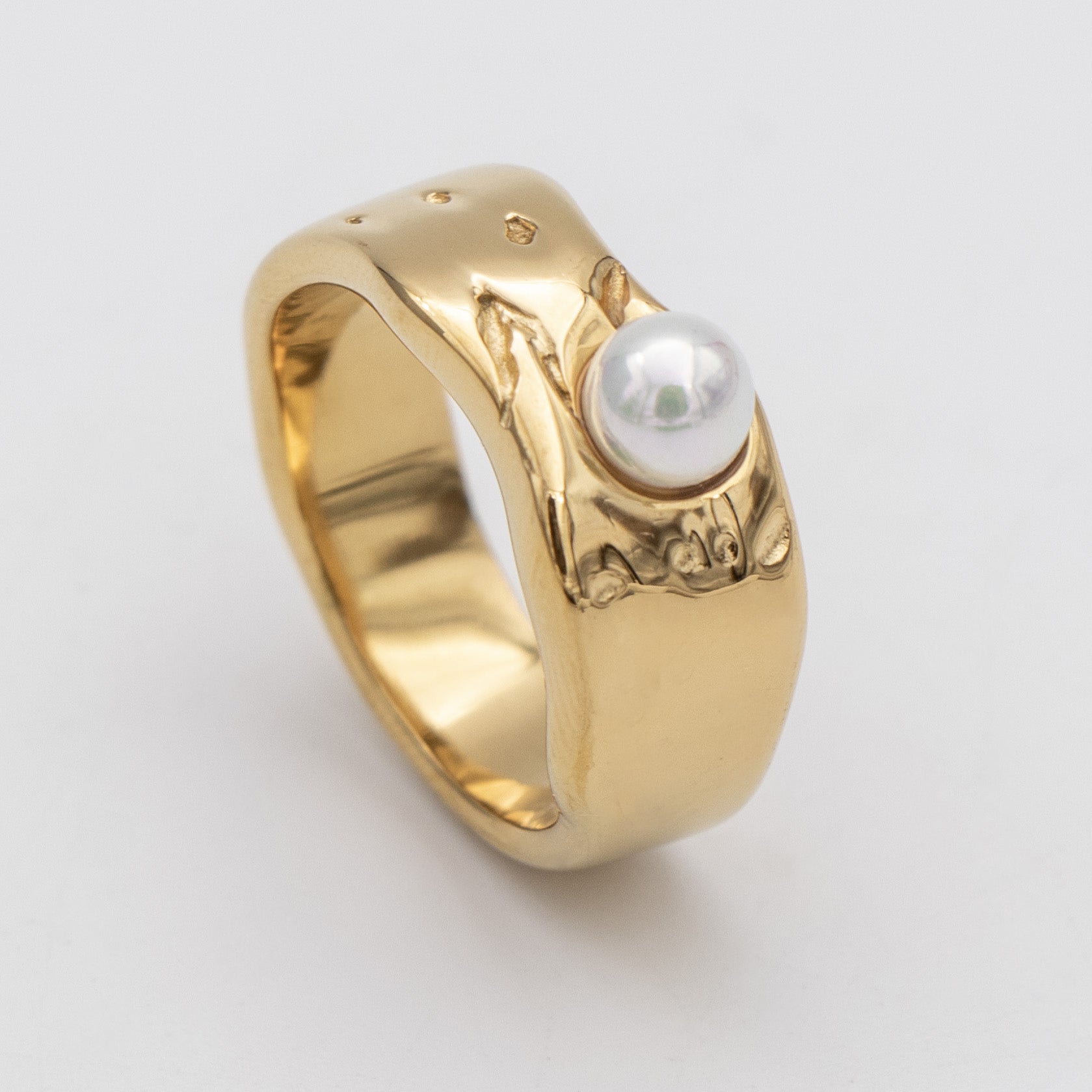 Nadine Pearl Ring, featuring a lustrous pearl set in a gold textured waved band from Prya