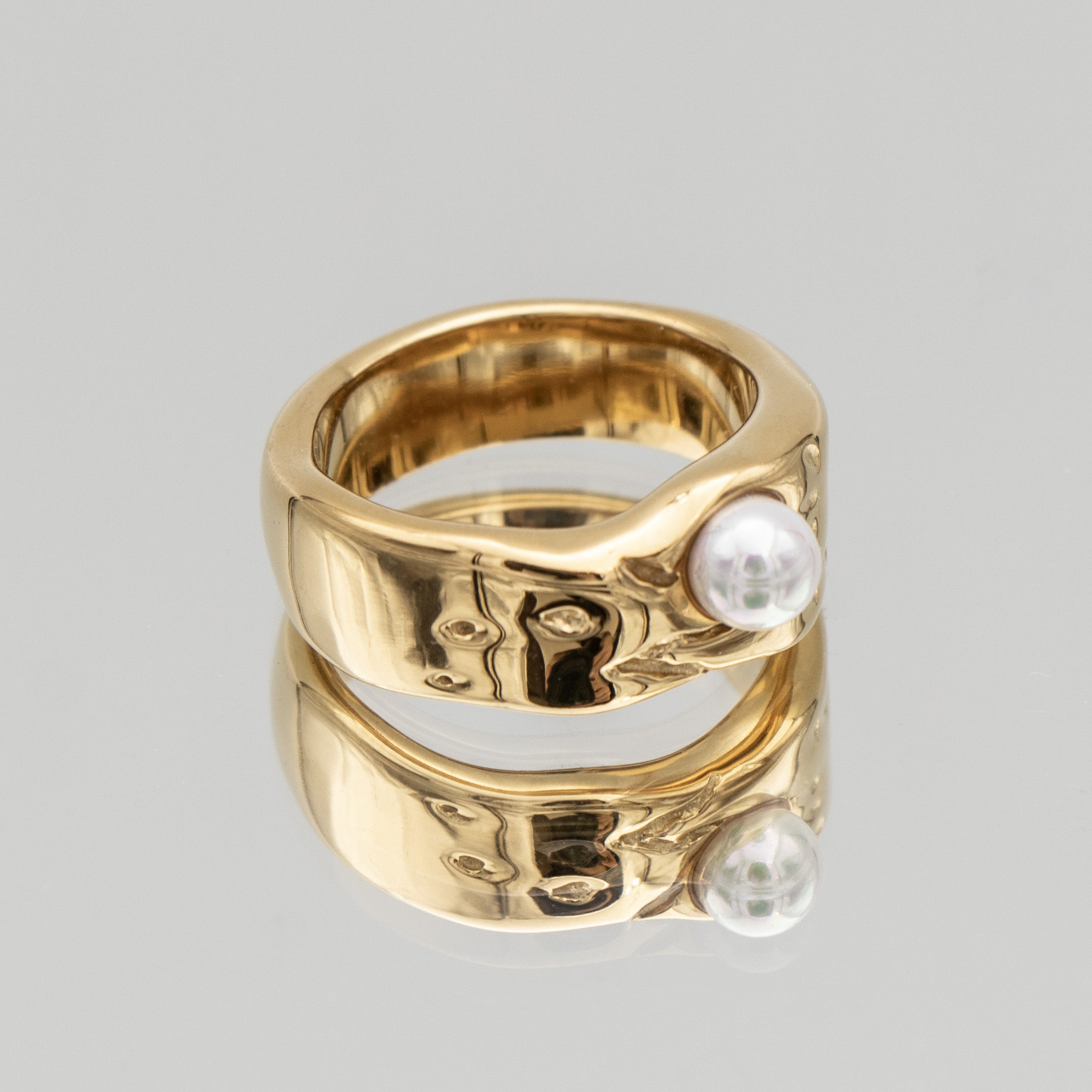 Nadine Pearl Ring, featuring a lustrous pearl set in a gold textured waved band from Prya