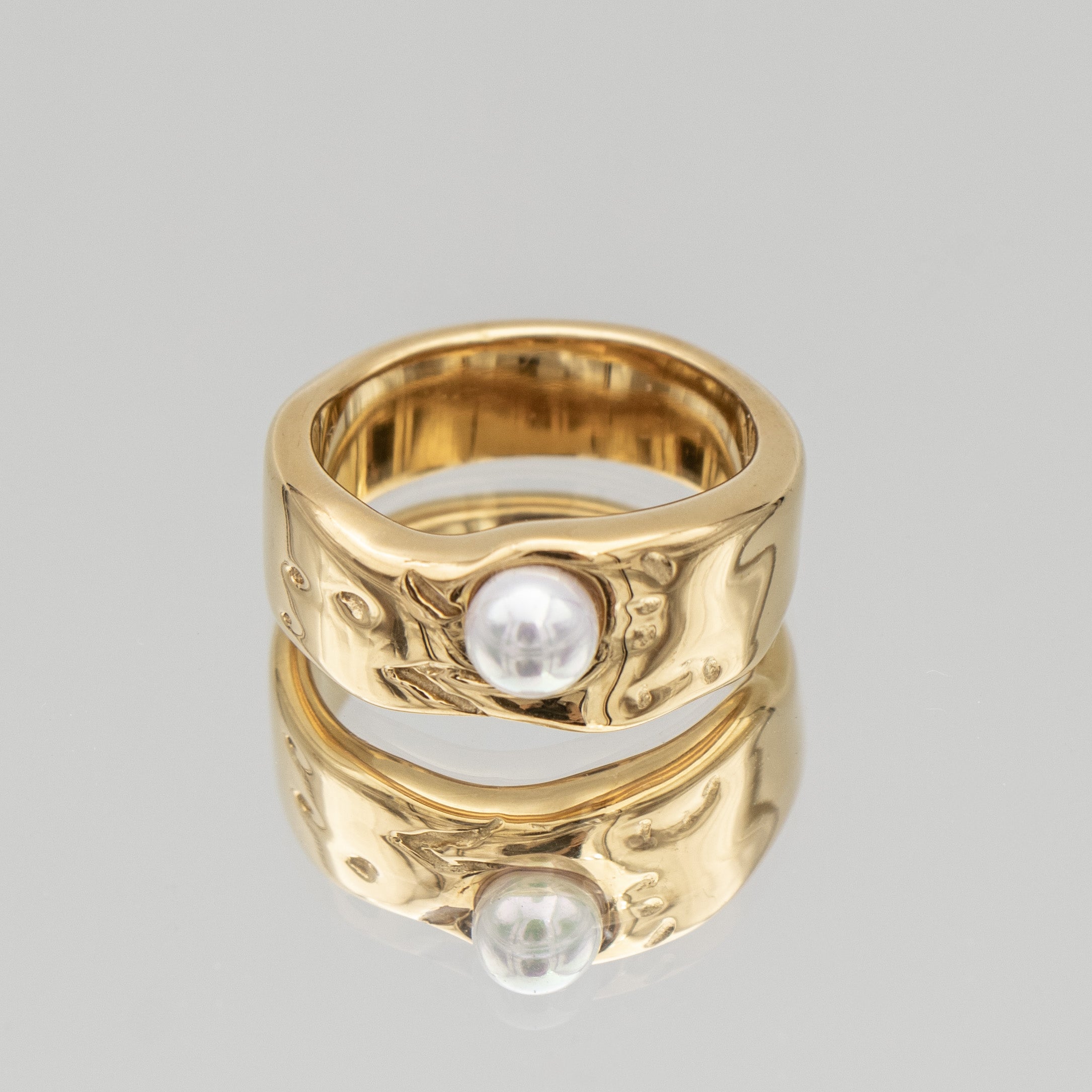 Nadine Pearl Ring, featuring a lustrous pearl set in a gold textured waved band from Prya