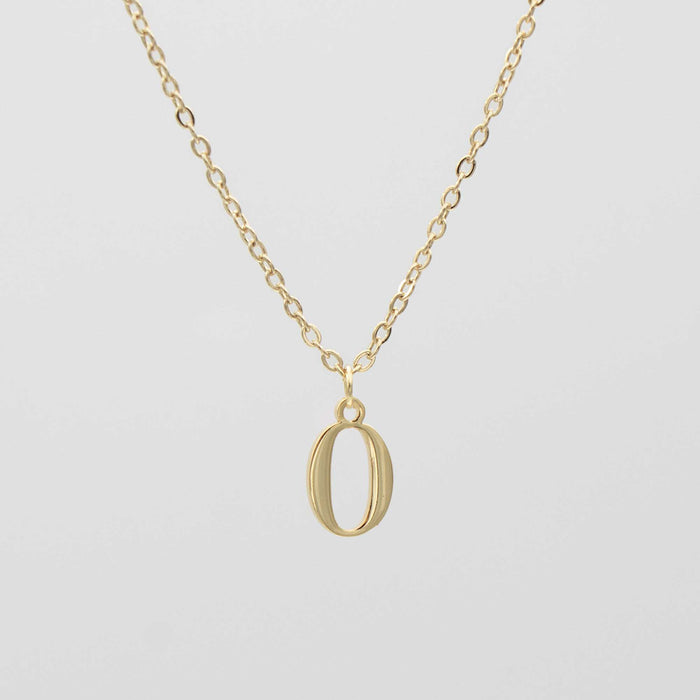 Gold plated initial necklace featuring the letter "O" on a delicate chain, perfect for personalization.