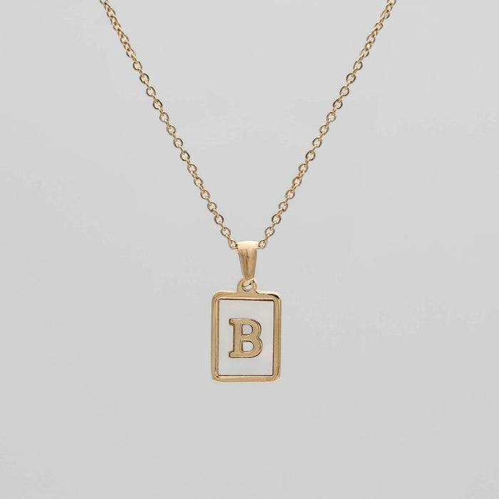 Gold opal necklace with a letter "B" pendant.