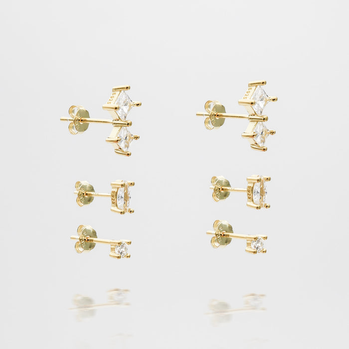 Gold stud earrings with square gemstones.